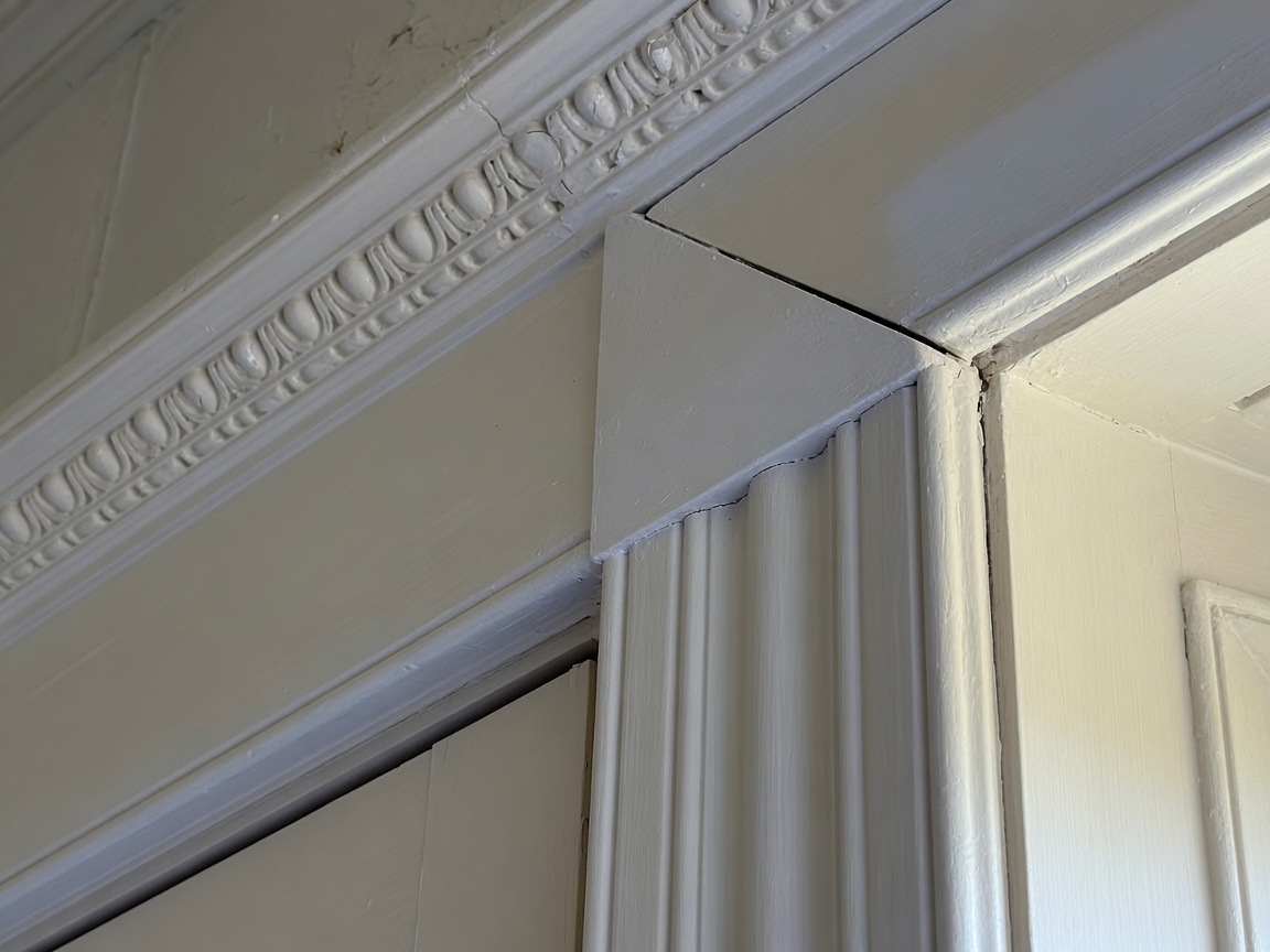 Precise painted crown molding and door casing